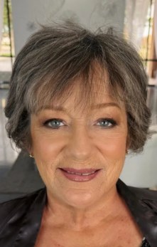 A woman's face showing where to apply setting powder: forehead, nose and chin only
